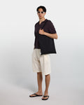 Polo in cotone marrone con collo aperto