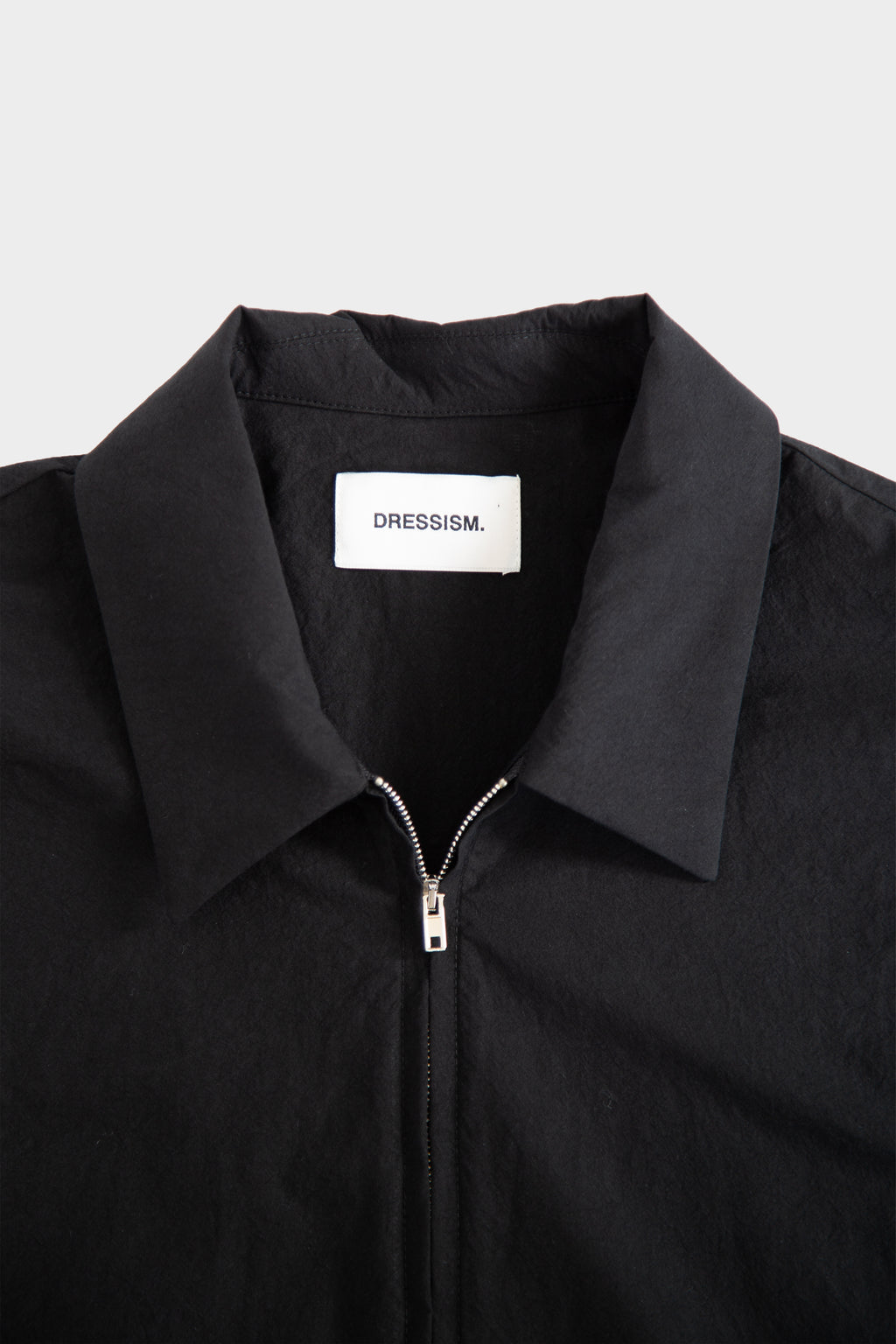 Camicia nera in popeline con zip e maniche corte