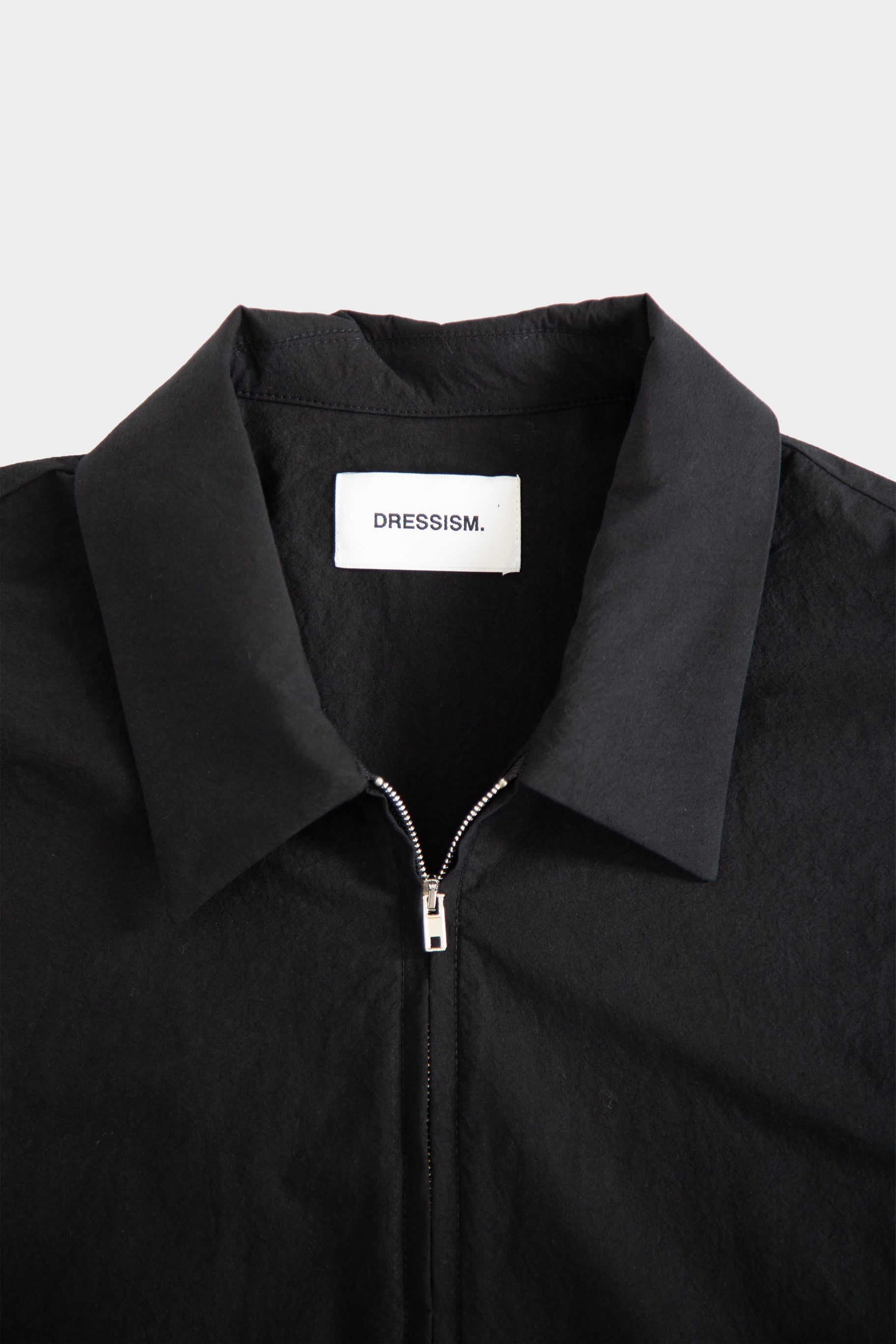 Camicia nera in popeline con zip e maniche corte