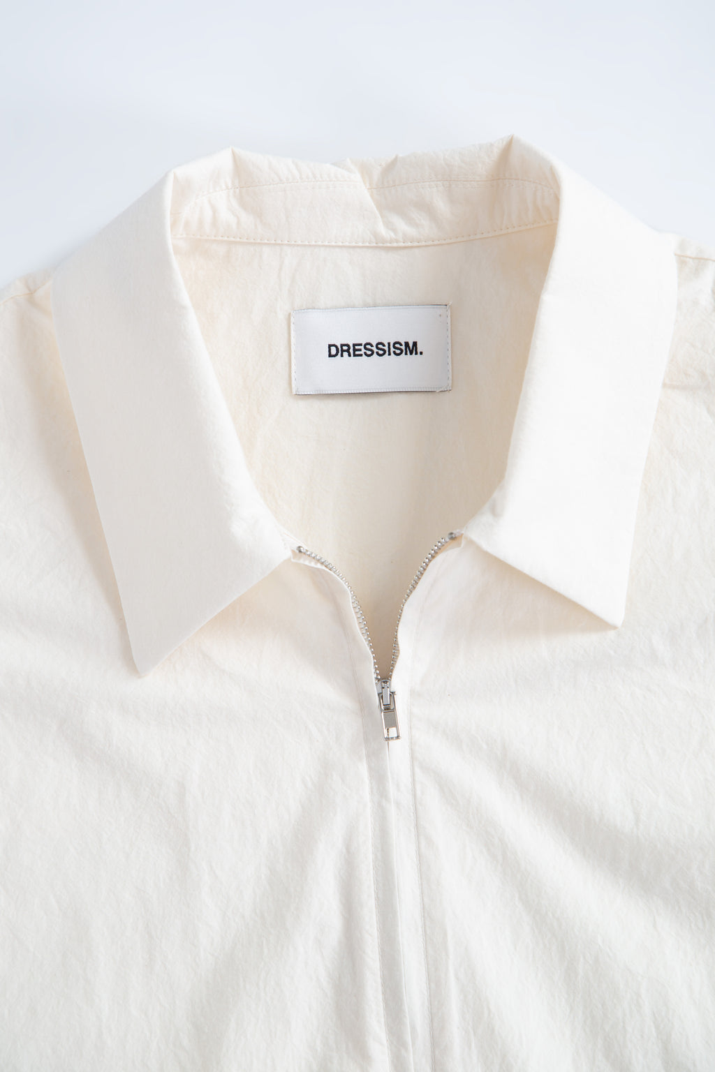 Camicia in popeline panna con zip e maniche corte