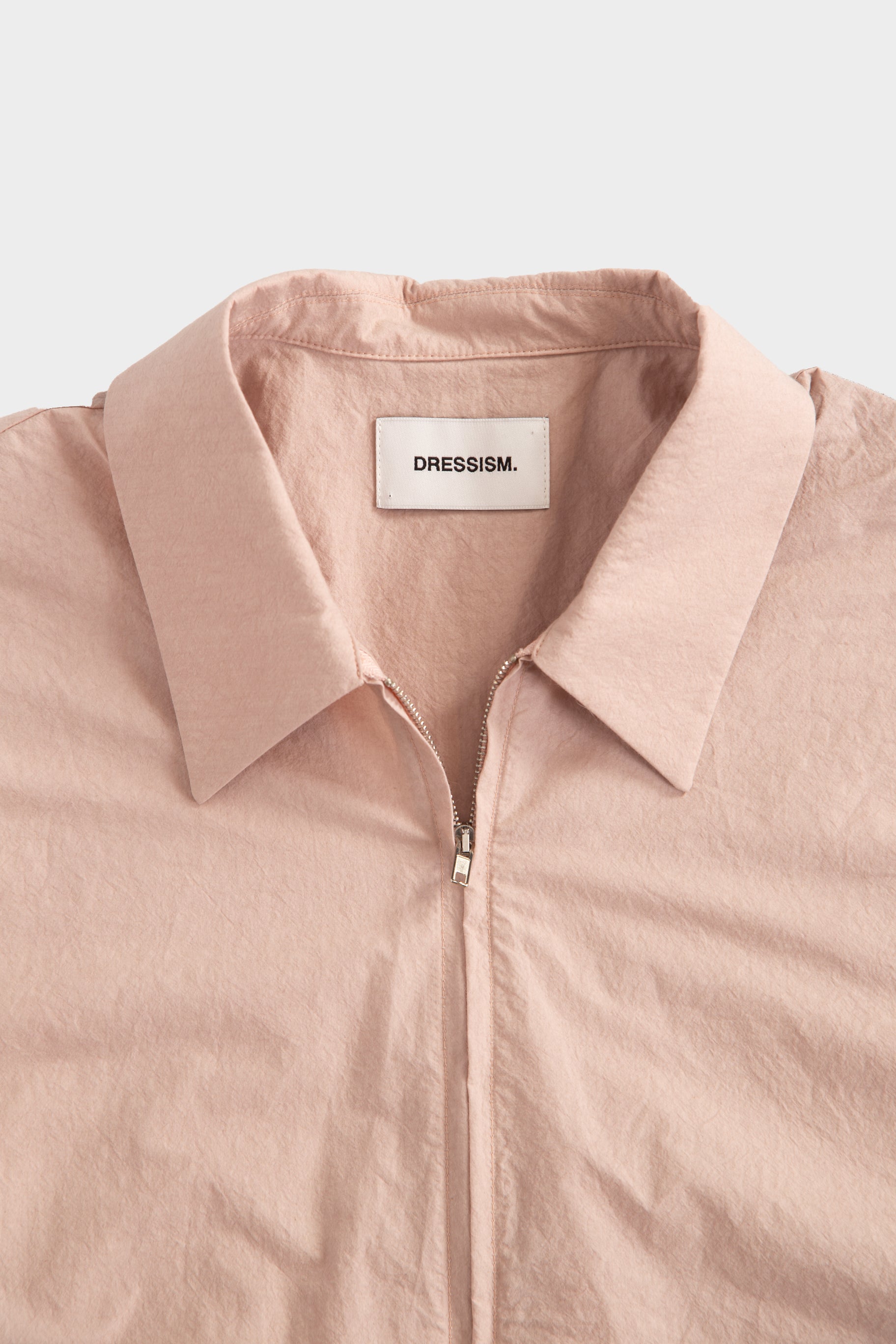 Camicia in popeline rosa con zip e maniche corte